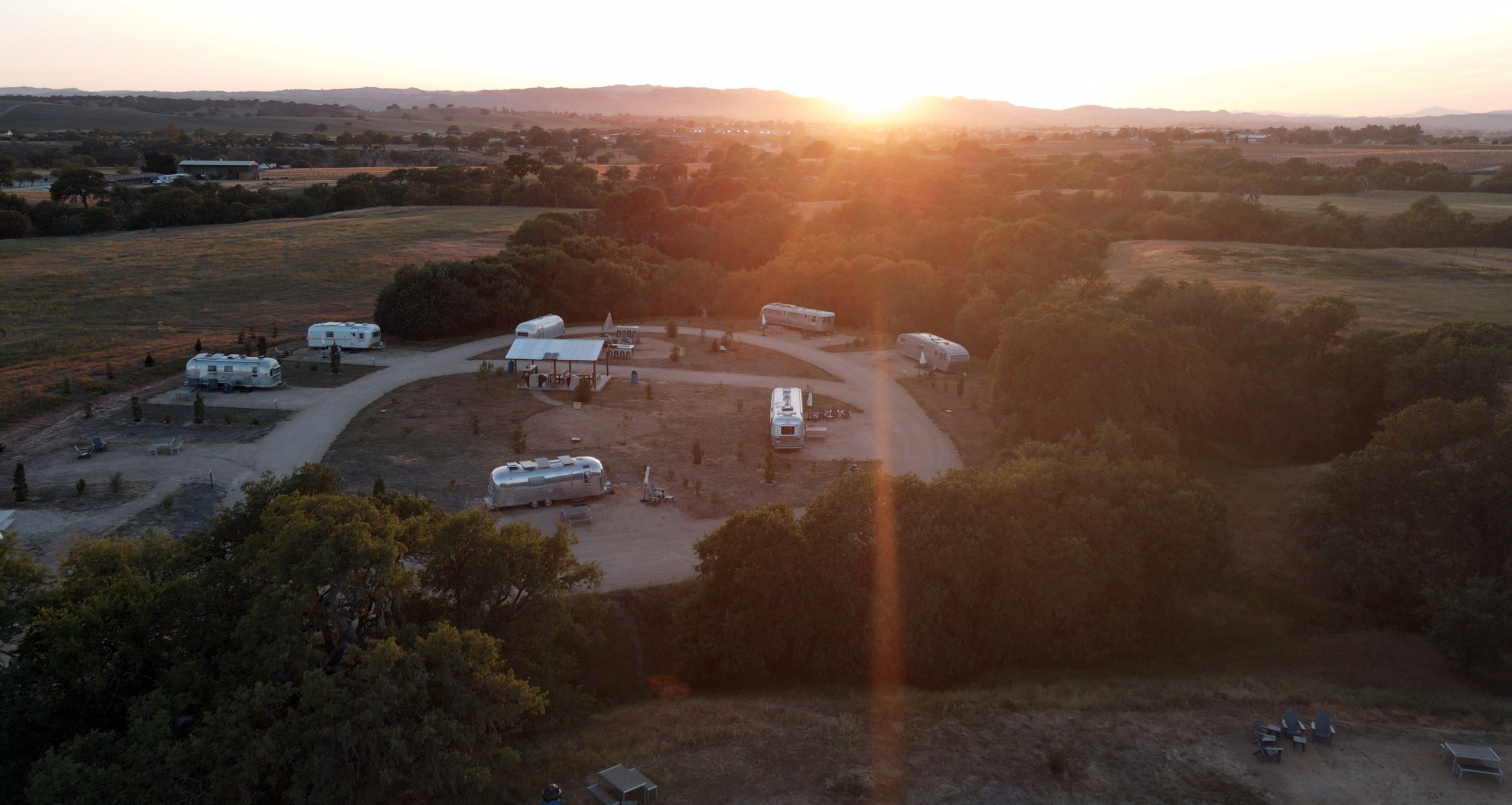 Sunset hill view of Vinyl Vineyards glamping trailers